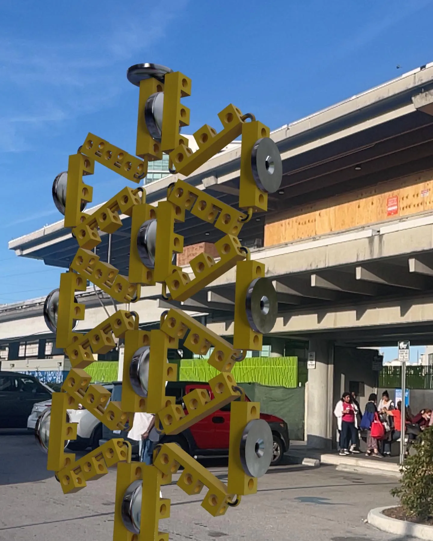 A yellow tool-like object positioned on a street by AR technology