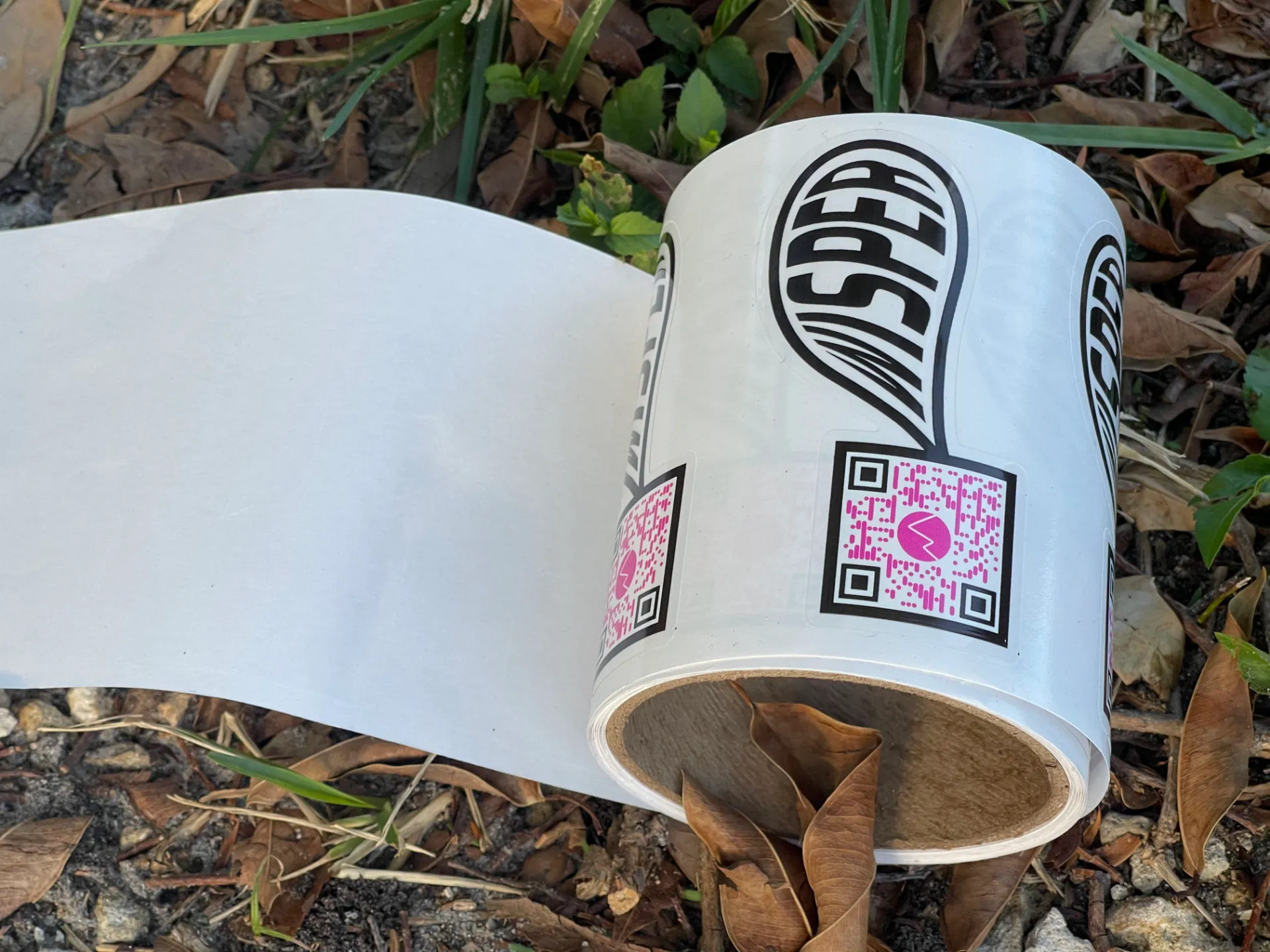 A wisper roll sticker on the ground