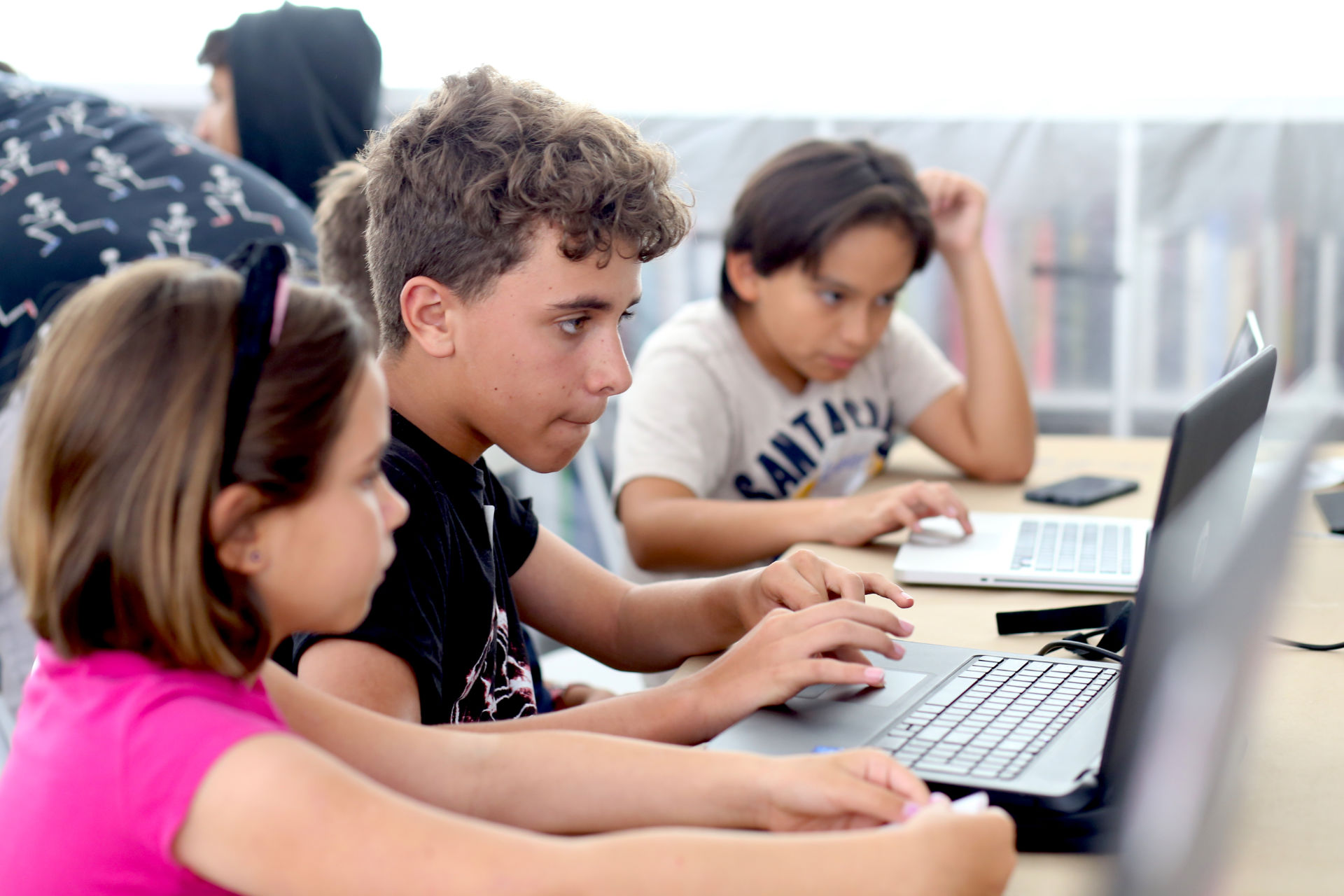 Kids working on a computers