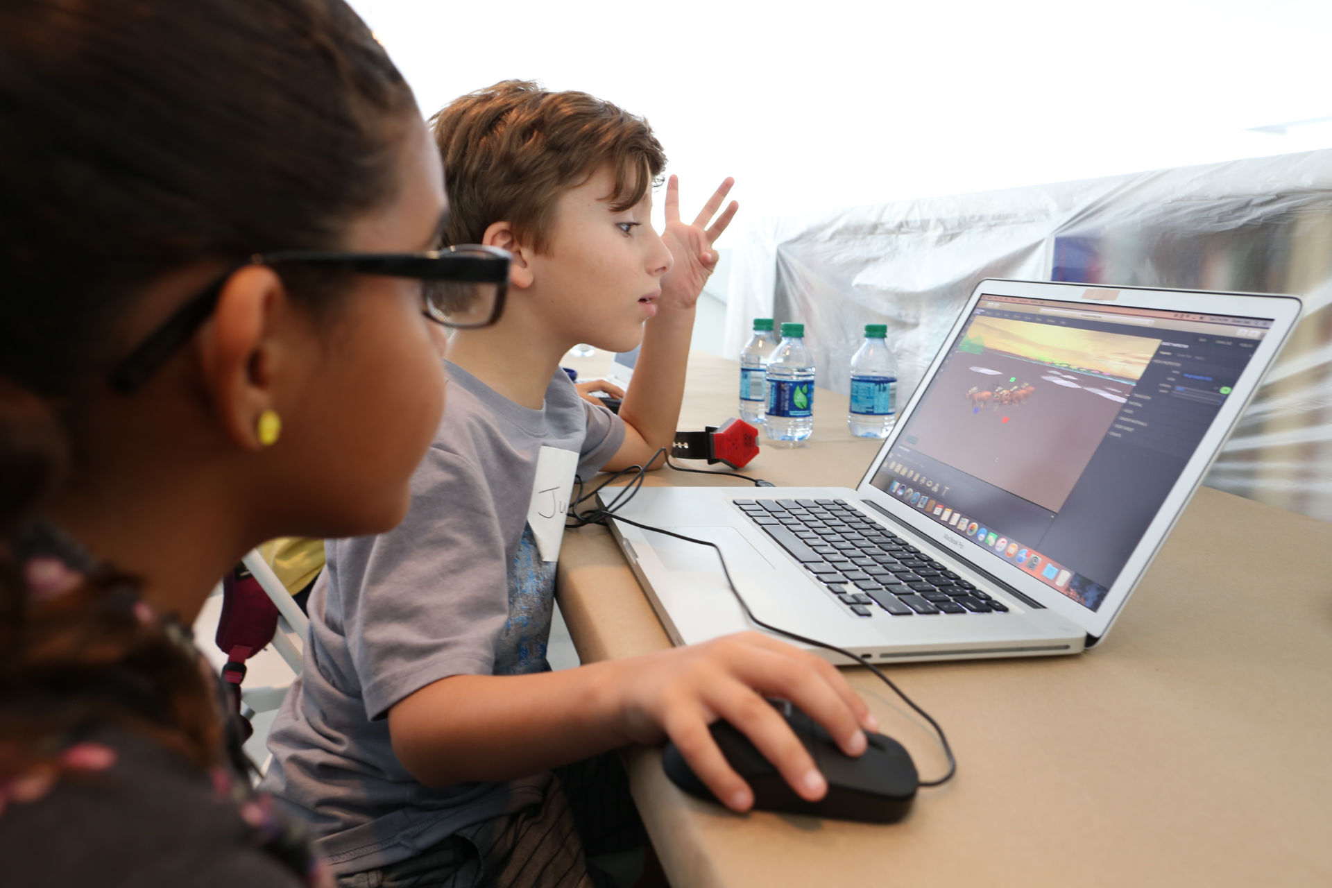 Kids on a laptop editing a 3D scene