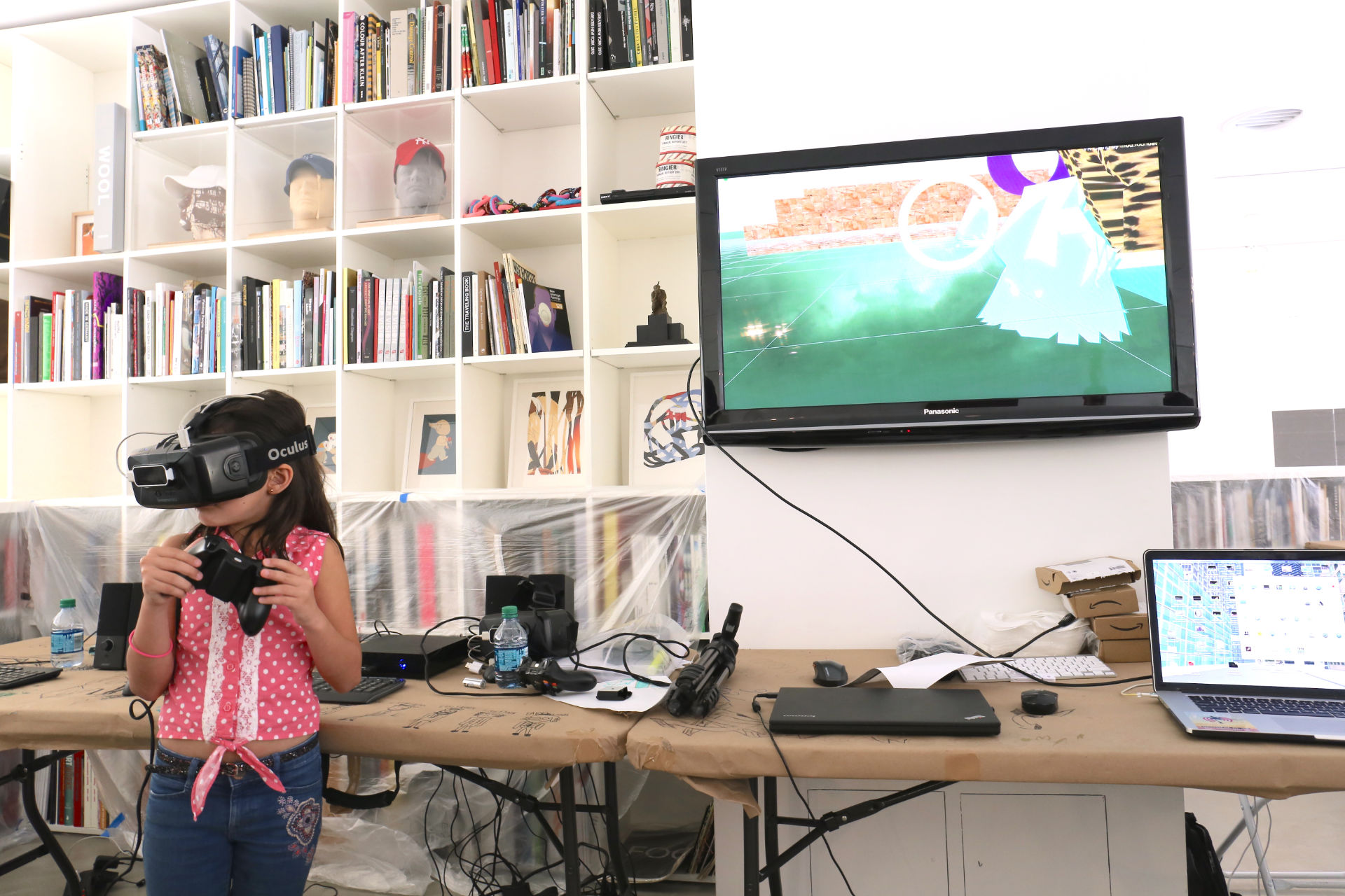 A kid playing with an Oculus 